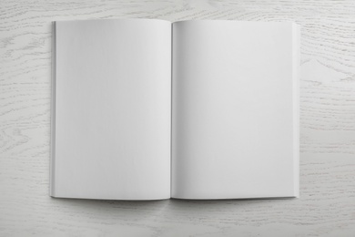 Mockup of open blank brochure on white background, top view