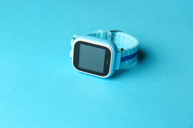 Modern trendy smart watch for kids on light blue background
