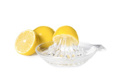 Plastic juicer and ripe lemons on white background