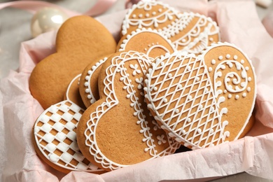 Tasty heart shaped gingerbread cookies in box, closeup