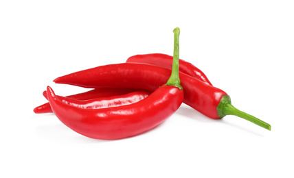 Photo of Ripe red hot chili peppers isolated on white