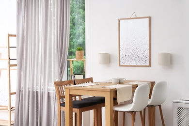 Photo of Modern room interior with wooden dining table