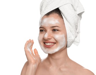 Young woman washing face with cleansing foam on white background. Skin care cosmetic