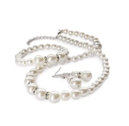 Elegant pearl necklace, bracelet and earrings on white background