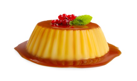 Photo of Delicious pudding with caramel, redcurrants and mint isolated on white