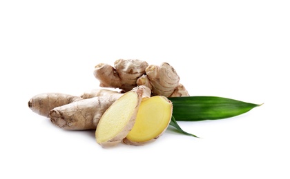 Whole and cut fresh ginger with leaves isolated on white