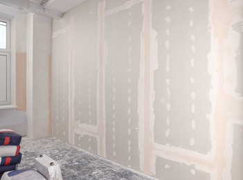 Wall with putty in room. Home renovation