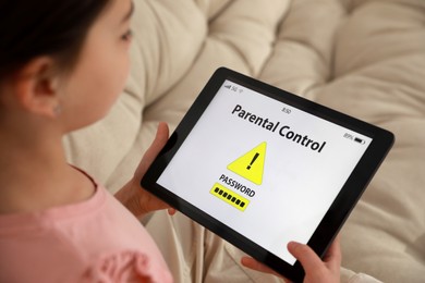 Little girl having access restriction by parental control on tablet, closeup. Child safety
