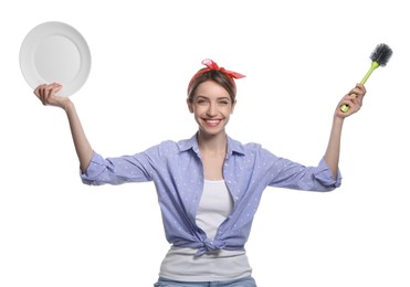Young housewife with plate and brush on white background