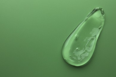 Photo of Sample of gel on green background, top view. Space for text