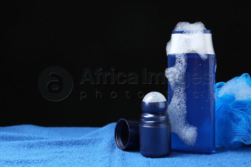 Men's personal hygiene products on blue soft towel