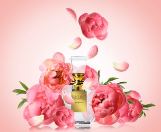 Bottle of luxury perfume and beautiful flowers on color background