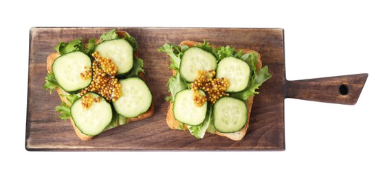 Tasty cucumber sandwiches with arugula and mustard on white background, top view