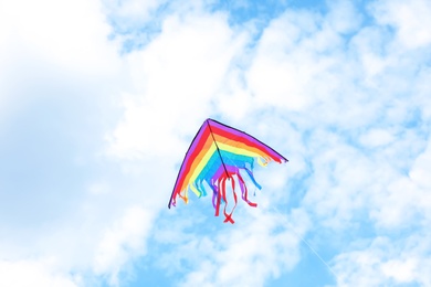 Beautiful kite drifting in blue sky