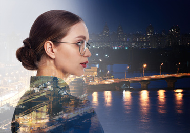 Image of Double exposure of businesswoman and night city landscape