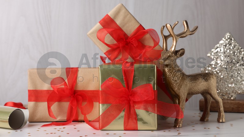 Beautifully wrapped gift boxes on white table