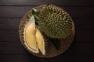 Fresh ripe durians on wooden table, top view