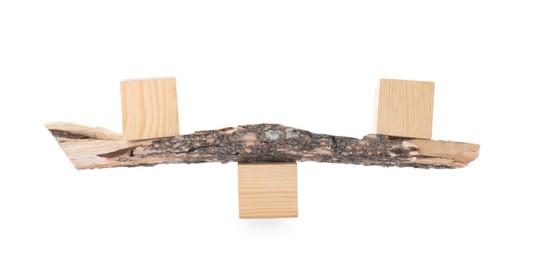 Tree branch with wooden cubes on white background. Harmony and balance concept