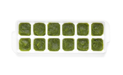 Broccoli puree in ice cube tray isolated on white, top view. Ready for freezing