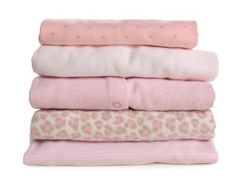 Stack of baby girl's clothes on white background