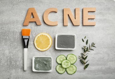 Word "Acne" and homemade effective problem skin remedies on grey background, flat lay