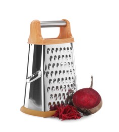 Stainless steel grater and fresh beetroot on white background