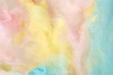Photo of Sweet colorful cotton candy as background, closeup view