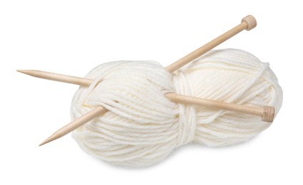 Soft woolen yarn with knitting needles on white background