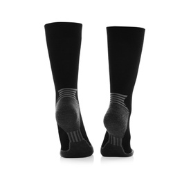 Woman wearing thermal socks on white background, closeup of legs. Winter sport clothes