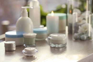 Set of body care cosmetics on table