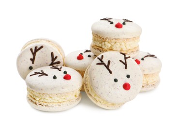 Pile of Christmas reindeer macarons on white background