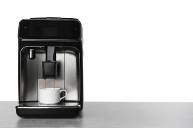 Making coffee with modern espresso machine on table against white background. Space for text