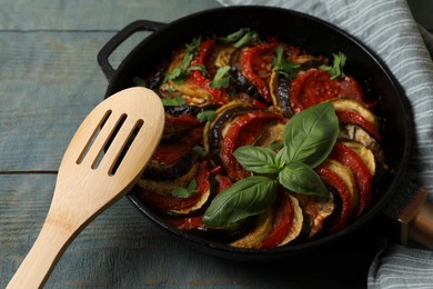 Photo of Delicious ratatouille on light blue wooden table, closeup