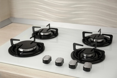 Photo of Modern built-in gas cooktop. Kitchen appliance