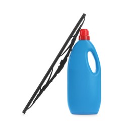 Bottle of windshield washer fluid and wiper on white background