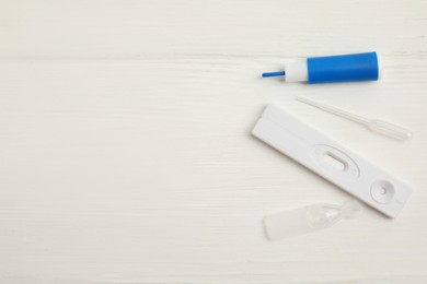Disposable express hepatitis test kit on white wooden table, flat lay. Space for text