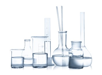 Photo of Laboratory glassware with liquid isolated on white