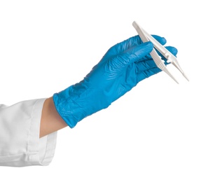 Photo of Doctor in medical glove with disposable forceps on white background