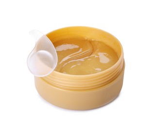 Under eye patches in jar with spatula isolated on white. Cosmetic product