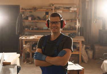 Portrait of professional male carpenter in workshop