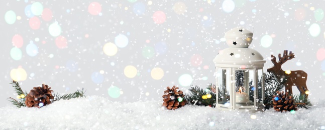 Composition with Christmas lantern on snow, space for text. Bokeh effect
