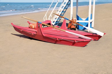 Rescue boat near watch tower on beach