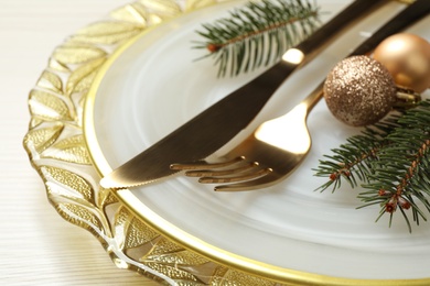 Beautiful Christmas table setting on white wooden background, closeup