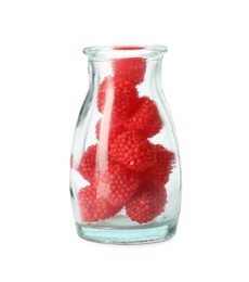 Delicious gummy raspberry candies in glass bottle on white background