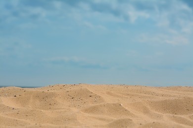 Closeup view of sandy beach on sunny day