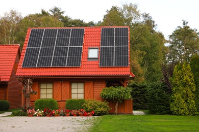 Photo of Beautiful house with solar panels outdoors. Real estate for rent