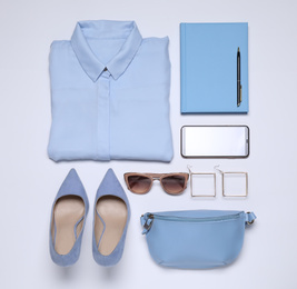 Flat lay composition with stylish clothes and accessories on white background