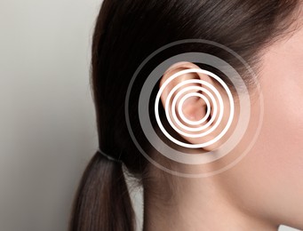 Hearing loss concept. Woman and sound waves illustration on light background, closeup