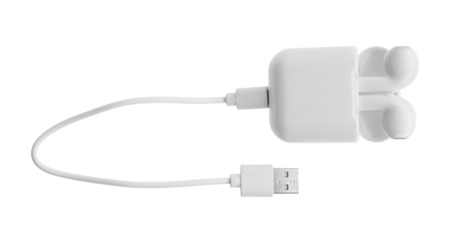USB charge cable and wireless earphones on white background. Modern technology