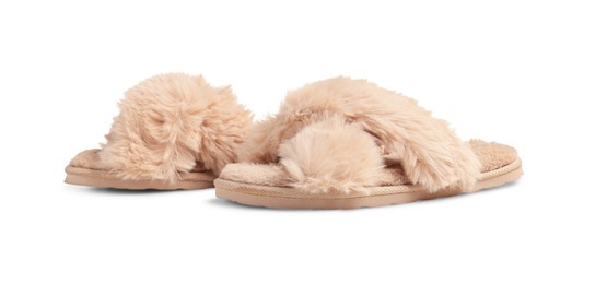 Pair of soft fluffy slippers on white background